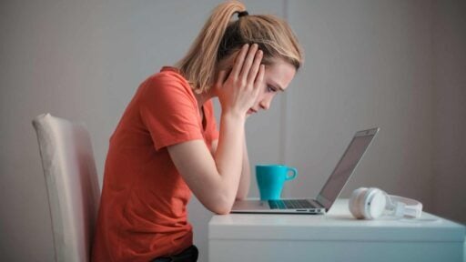 a worried investor with a laptop