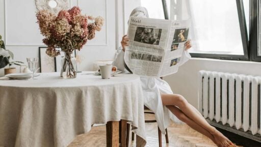 an expat in Australia reading newspaper