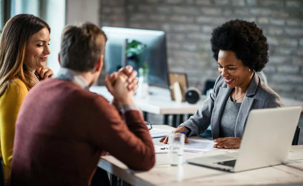 couple meeting with financial advisor iStock 1135204036