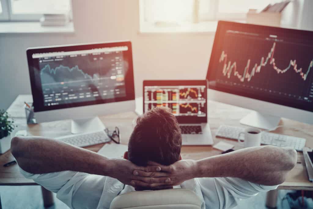 Relaxed investor observing market trends