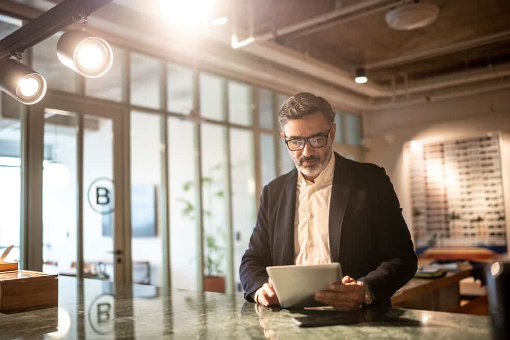 Businessman using digital tablet at modern office