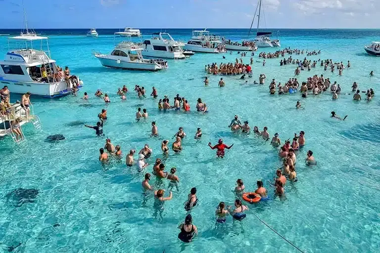 people swimming in the caribbean ocean