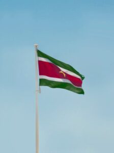 Tax residency in Suriname is based on physical presence and permanent ties. An individual is considered a resident for tax purposes if they live in the country for more than half the year or maintain a dwelling available for continuous use.